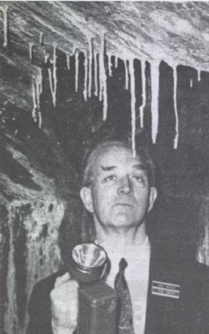 Ron Brown inspects the stalactites which date the cellars circa 1400